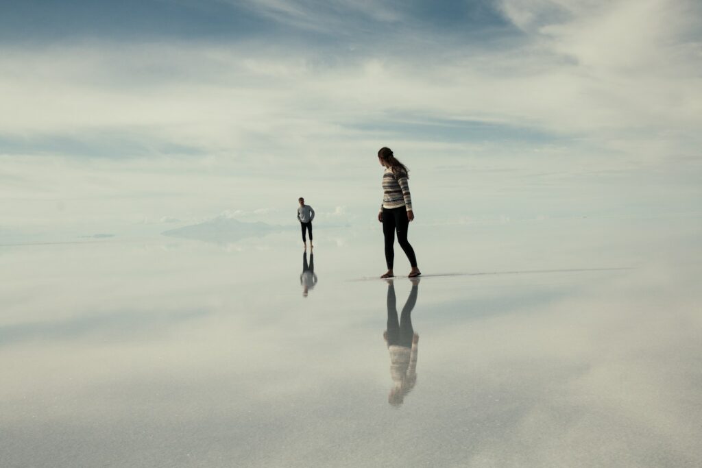 man and woman walking on clouds