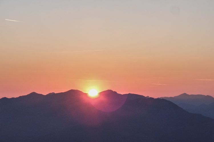 silhouette photo of mountain during dawn