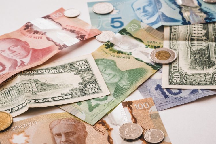 a pile of money sitting on top of a table