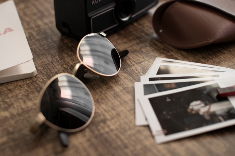 shallow focus photo of black sunglasses with silver frames