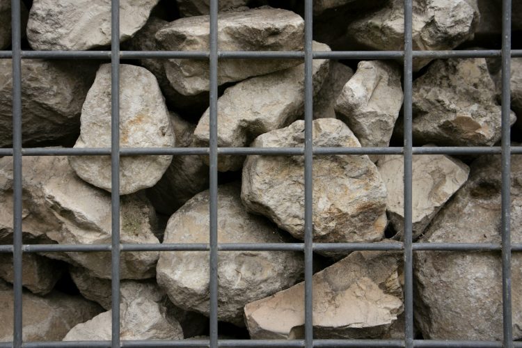 a bunch of rocks that are in a cage