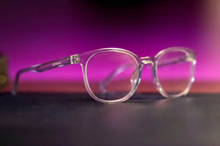 a pair of glasses sitting on top of a table
