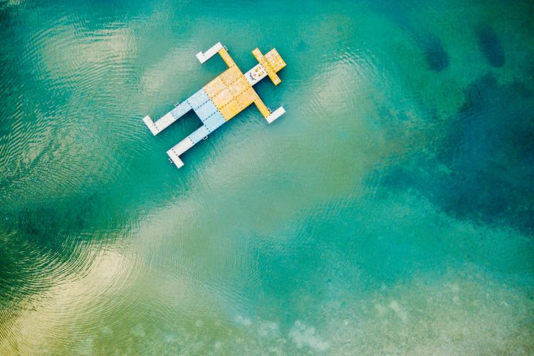 wooden toy floating on body of water
