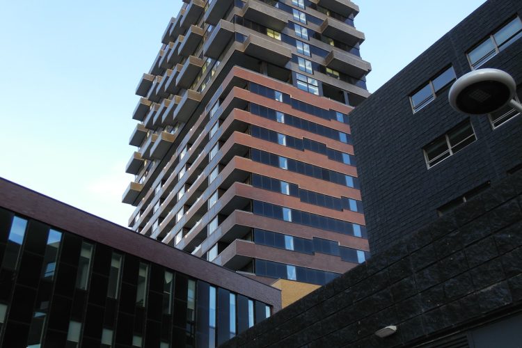 a tall building next to another tall building