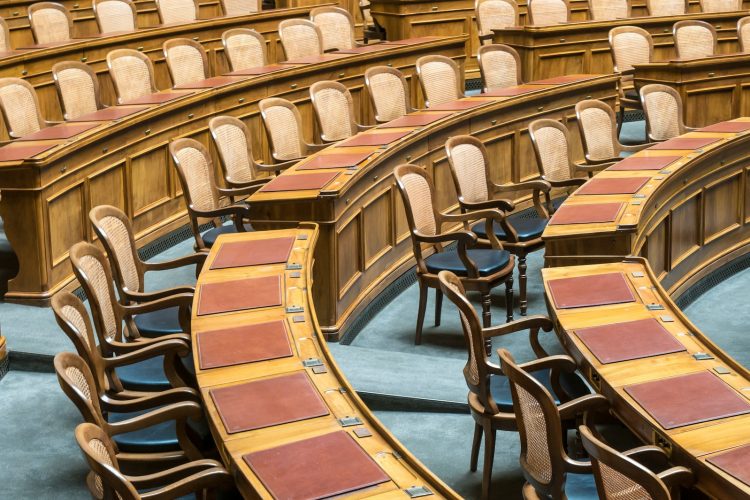 brown wooden chairs on blue and brown wooden floor