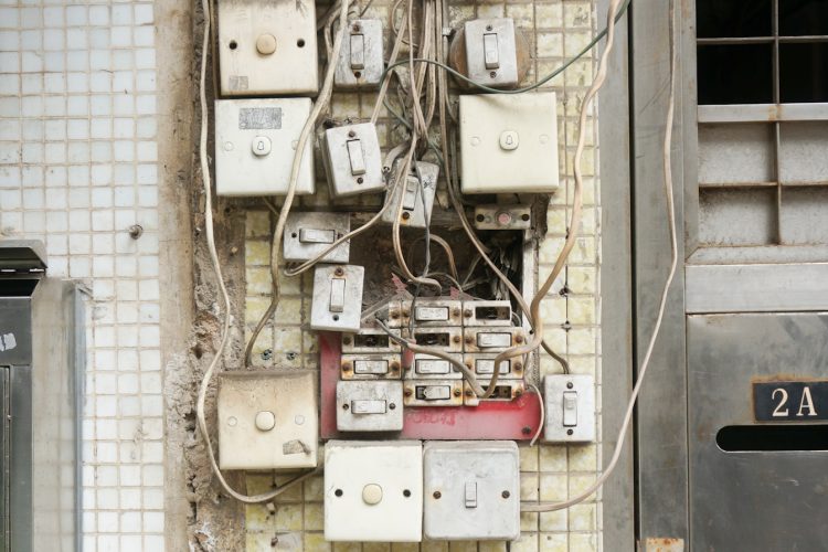 several assorted power switches mounted on white wall