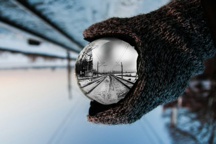 person holding clear ball