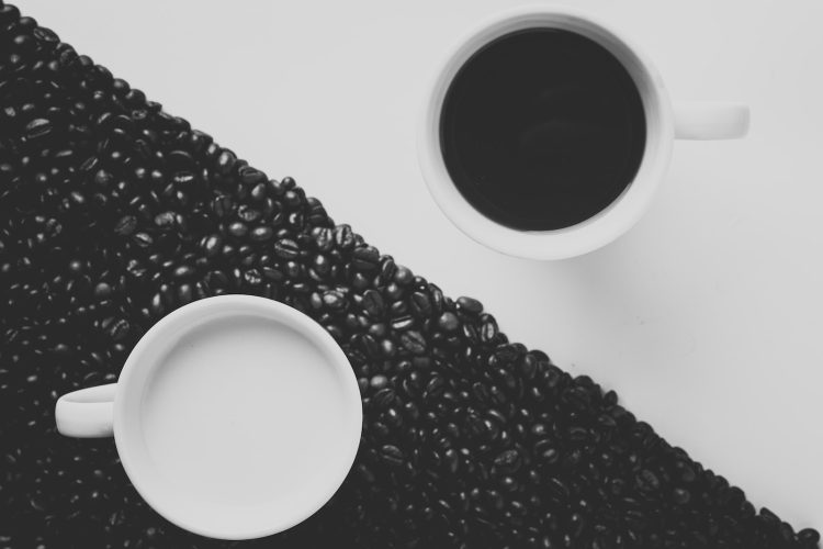 white ceramic coffee mug filled with black liquid