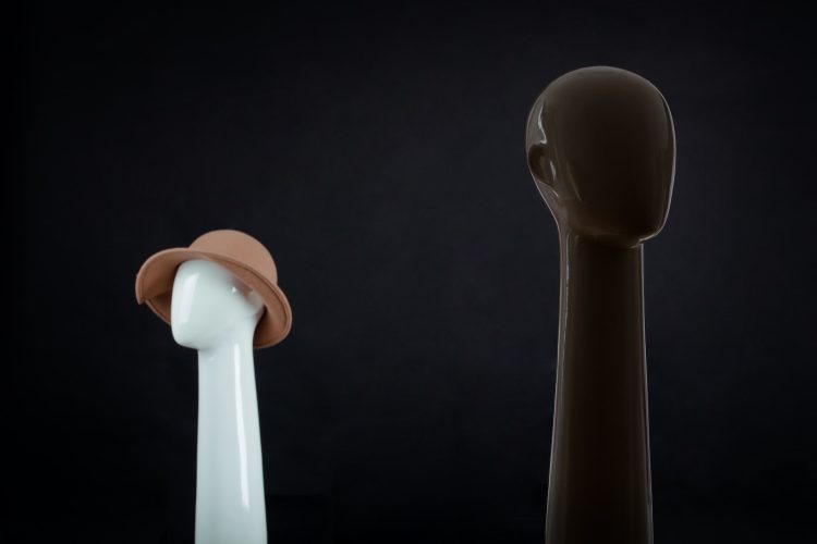 a white and a brown object on a black background